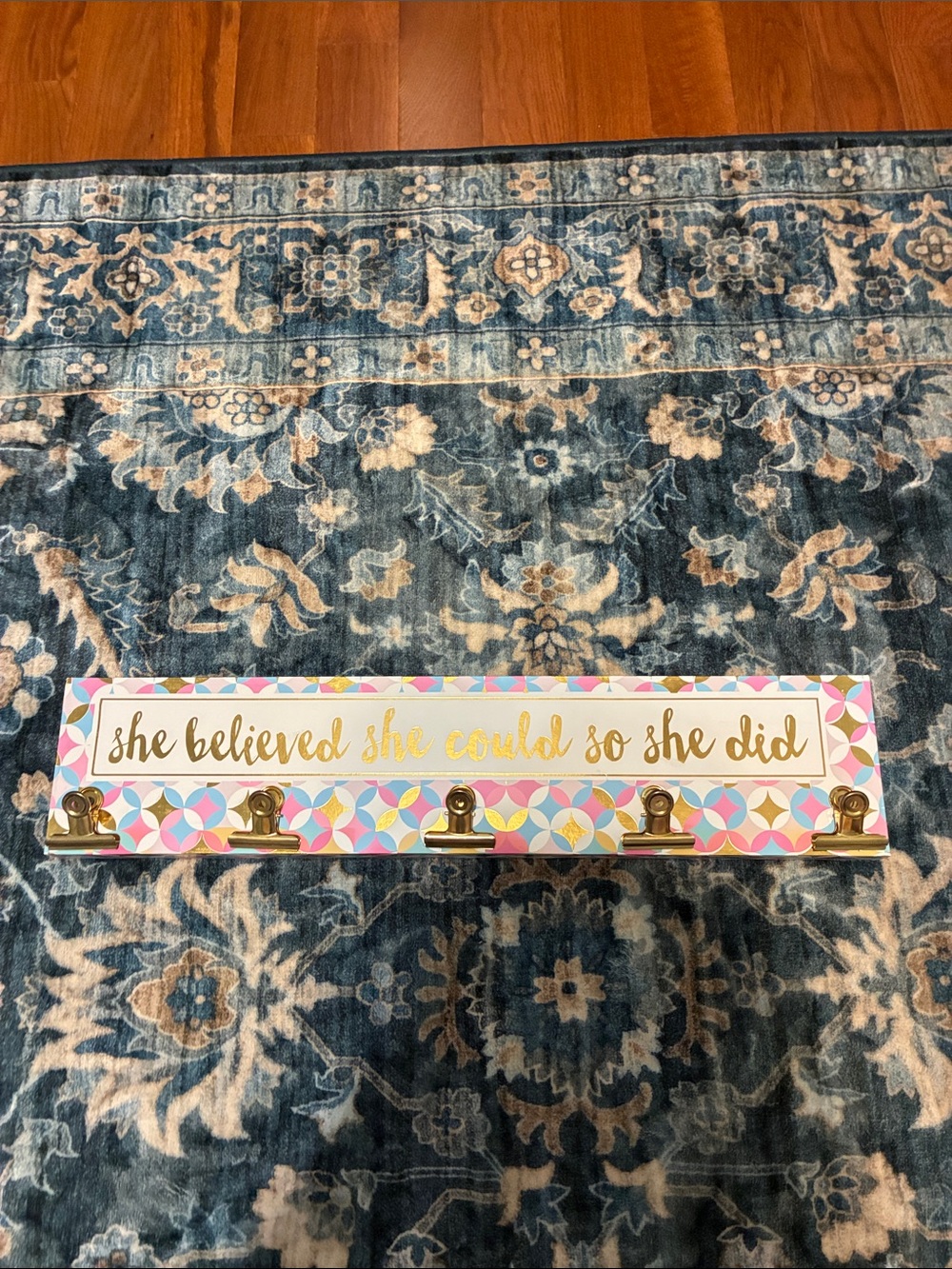 Gold Clip Wall Hook hanging with Pink, Blue & Yellow Pattern